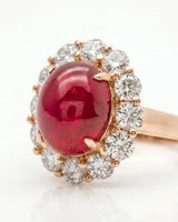 Vintage ruby ring with floral diamond halo and romantic rose gold setting | SARATTI