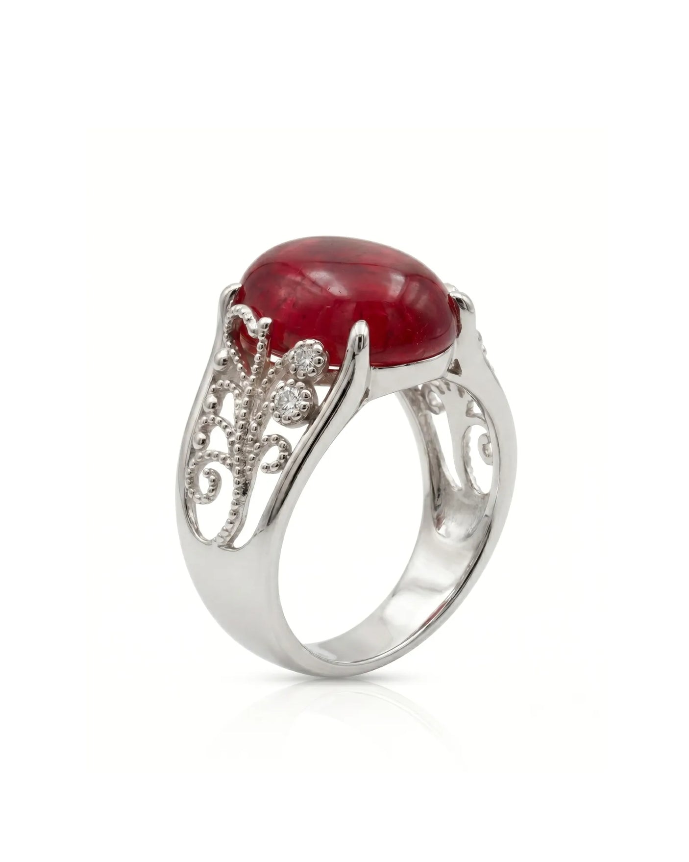 Vintage ruby ring with scrollwork sides and round diamonds in platinum | SARATTI
