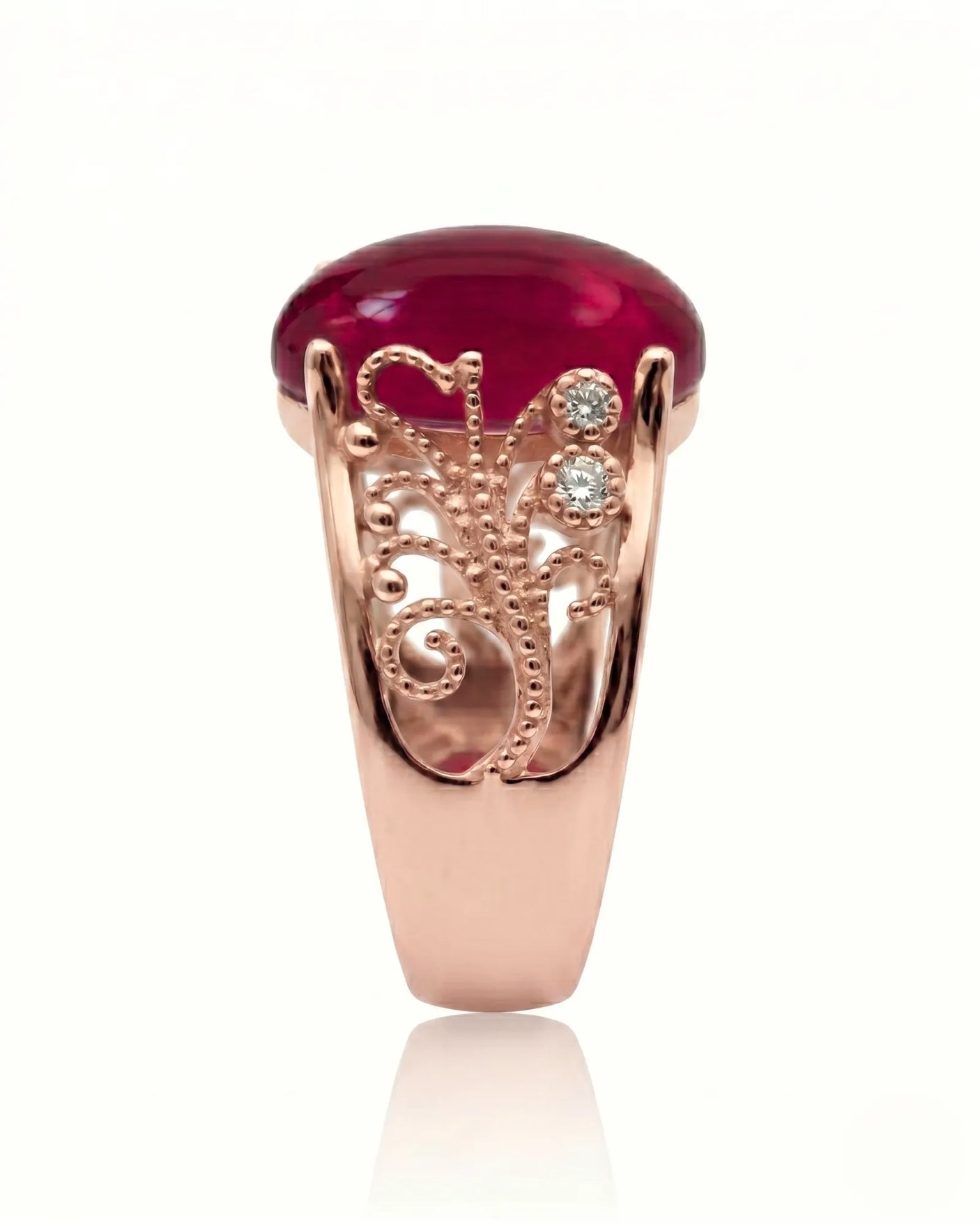 Vintage ruby ring with scrollwork sides and round diamonds in rose gold | SARATTI