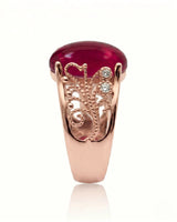 Vintage ruby ring with scrollwork sides and round diamonds in rose gold | SARATTI