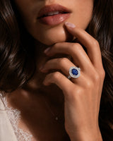 Vintage sapphire engagement ring with architectural diamond halo and channel shoulders in 18K white gold | SARATTI