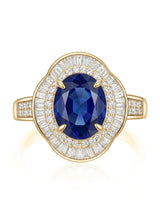 Vintage sapphire engagement ring with architectural diamond halo and channel shoulders in 18K yellow gold | SARATTI