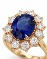 Vintage sapphire ring with round and kite-shaped diamonds in warm yellow gold | SARATTI