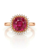 Vivid crimson oval tourmaline ring framed by natural diamonds in 18K rose gold | SARATTI