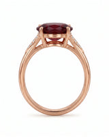 Vivid deep red oval garnet ring with natural diamond accents in 18K rose gold | SARATTI