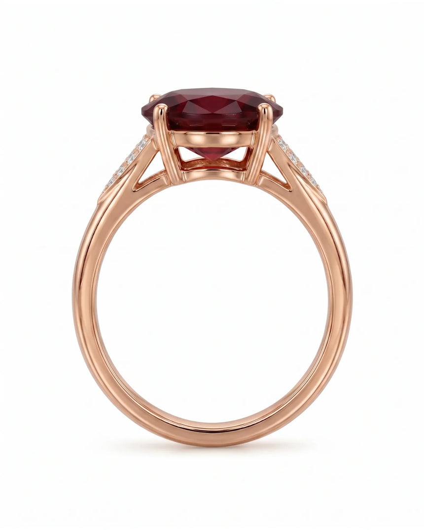 Vivid deep red oval garnet ring with natural diamond accents in 18K rose gold | SARATTI