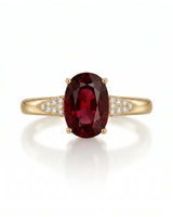 Vivid deep red oval garnet ring with natural diamond accents in 18K yellow gold | SARATTI