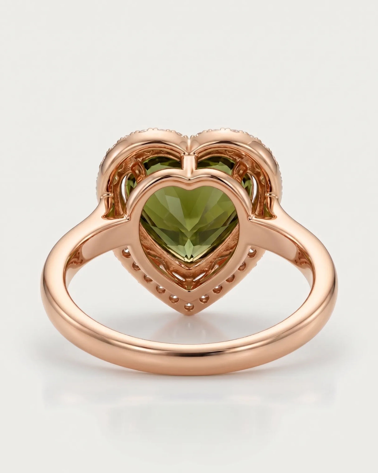 Vivid green heart tourmaline ring framed by natural diamonds in 18K rose gold | SARATTI
