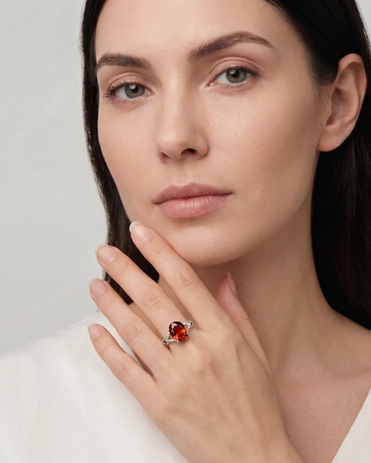 Vivid orange oval garnet ring with natural diamond shoulders in 18K white gold | SARATTI