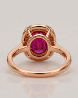 Vivid pink oval tourmaline ring framed by natural diamonds in 18K rose gold | SARATTI