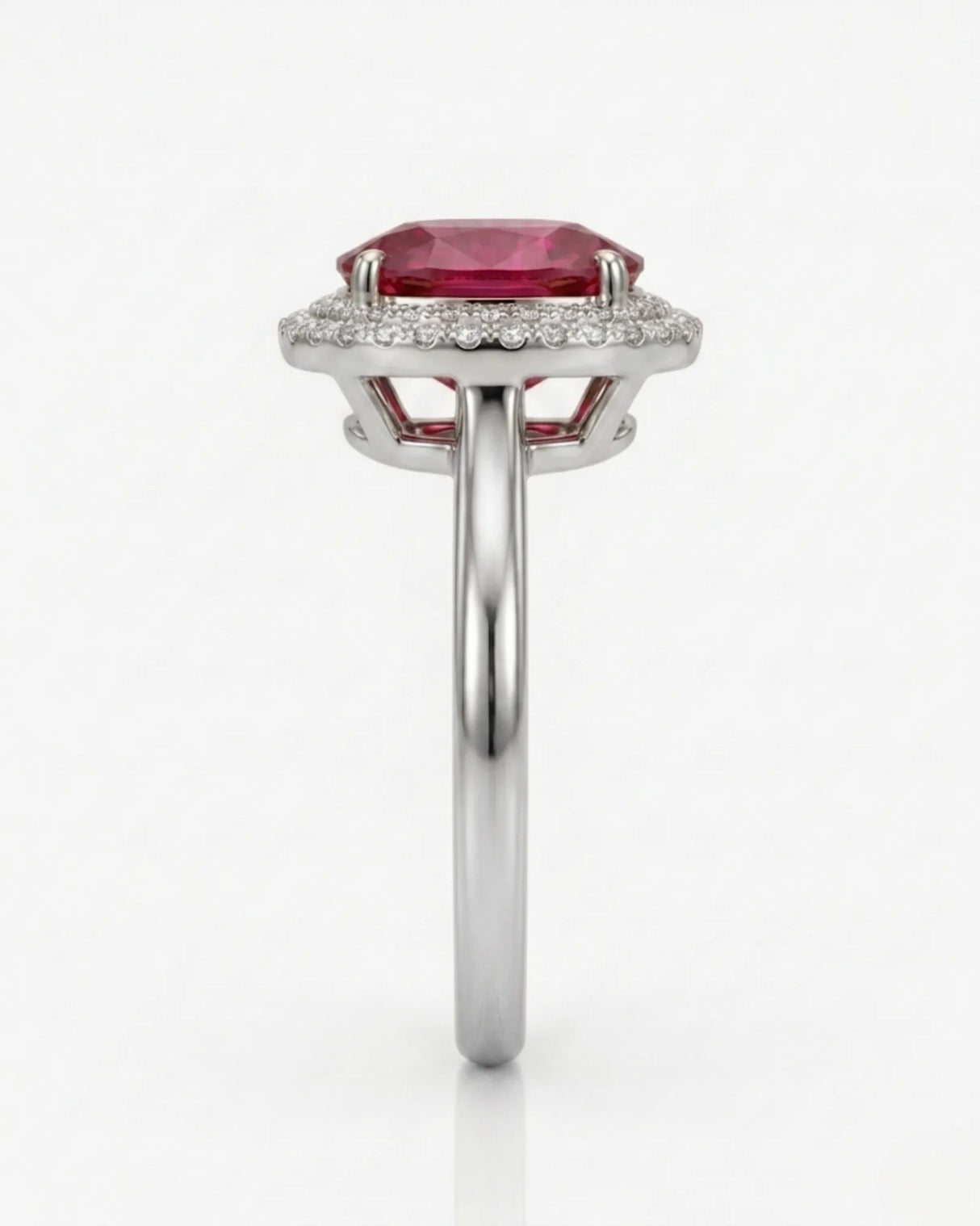 Vivid pink oval tourmaline ring framed by natural diamonds in 18K white gold | SARATTI