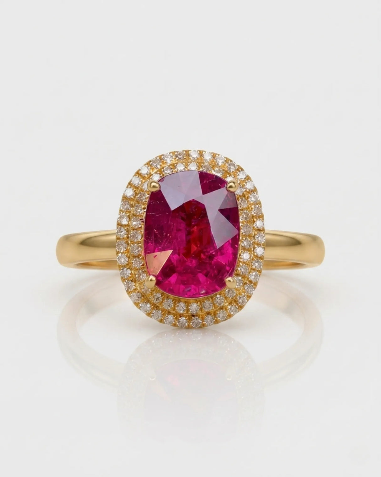 Vivid pink oval tourmaline ring framed by natural diamonds in 18K yellow gold | SARATTI