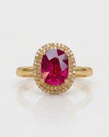 Vivid pink oval tourmaline ring framed by natural diamonds in 18K yellow gold | SARATTI
