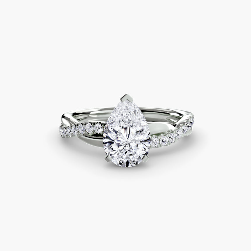Diamond ring with a pear-shaped center stone on a white background - SARATTI