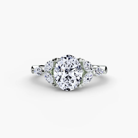 Diamond ring with a white background - Oval Cut Diamond with Marquise side stones set in Platinum Ring - SARATTI