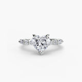 Heart-shaped diamond ring with a white background