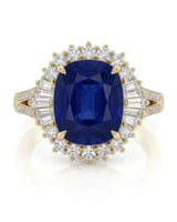Warm yellow gold frames a royal blue sapphire with baguette and round diamond detailing | SARATTI
