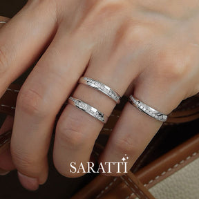 Model Stacking Three White Gold Oblong Channel Set Diamond Eternity Wedding Bands with a leather bag | Saratti
