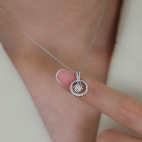 Model's finger showing the diamond pendant of the Aura di Diamante Diamond Necklace  | Saratti