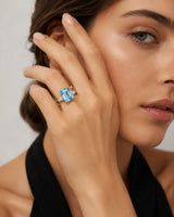 White gold aquamarine ring with emerald cut center and tapered baguette diamond side stones | SARATTI