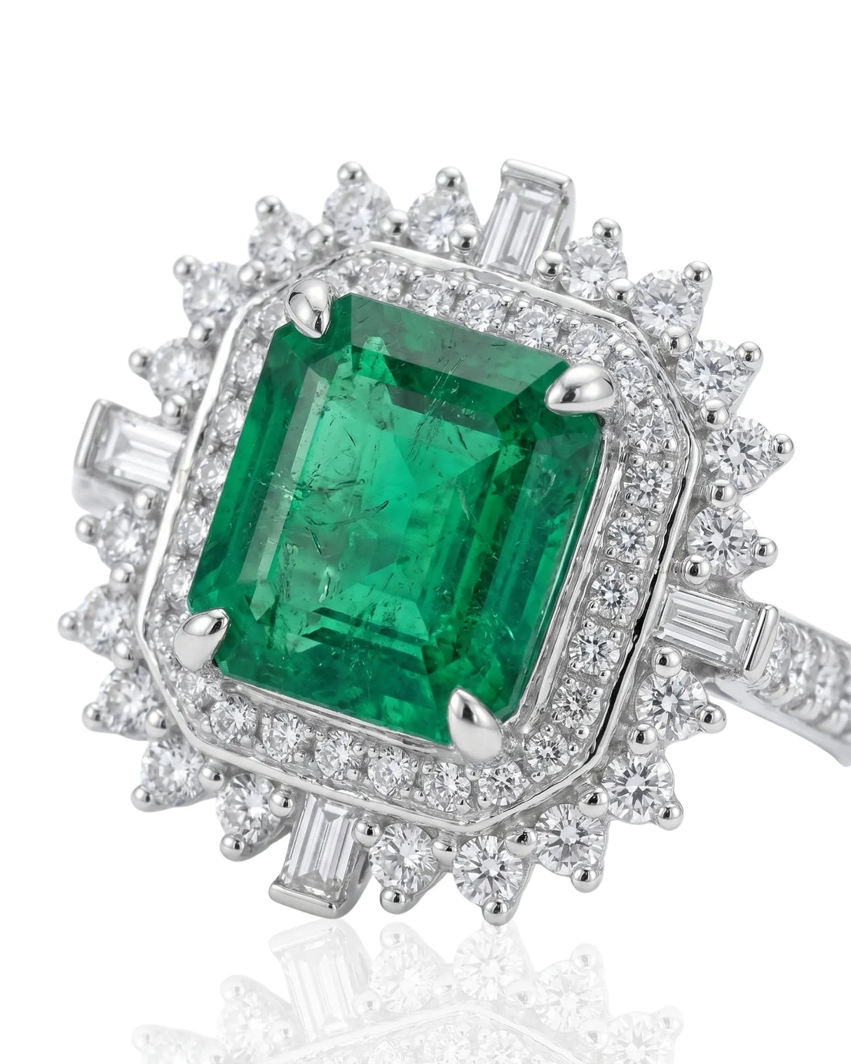 White gold emerald and diamond ring with bold halo design | SARATTI