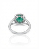 White gold emerald engagement ring and matching curved band for a distinctive proposal | SARATTI