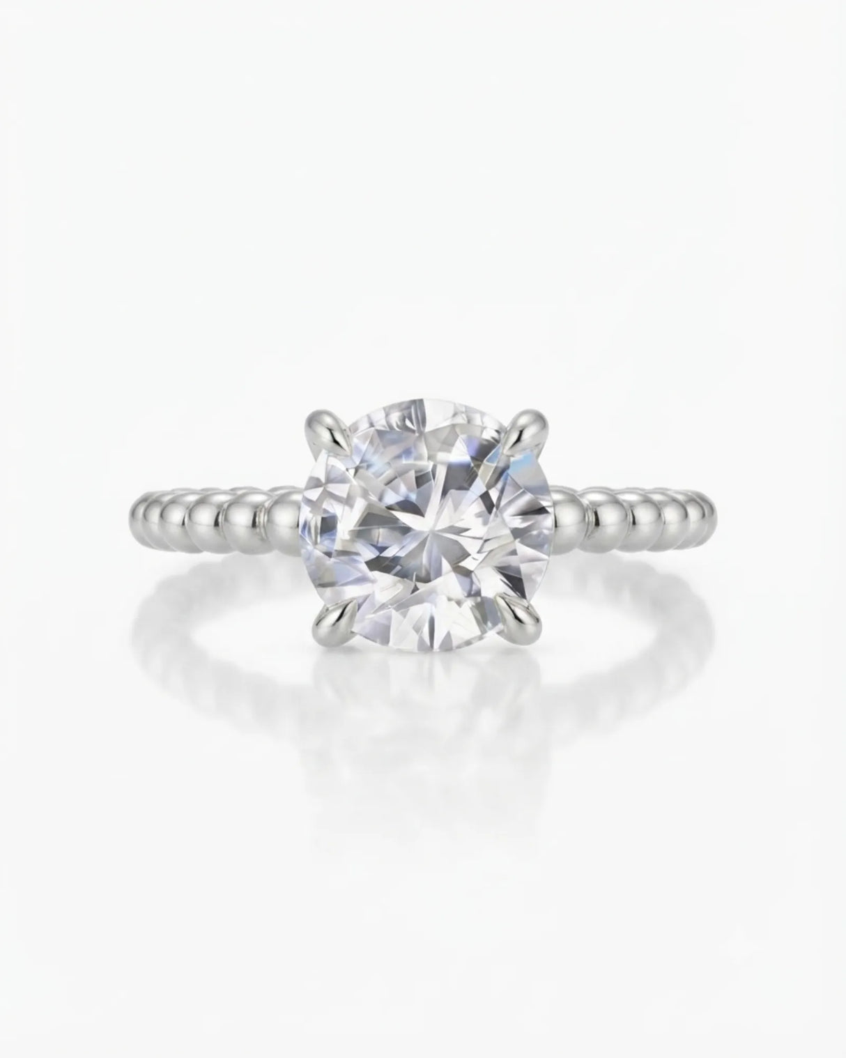 White gold moissanite engagement ring for a modern proposal with distinctive beaded craftsmanship | SARATTI