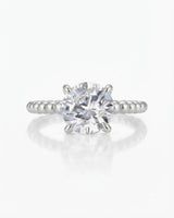 White gold moissanite engagement ring for a modern proposal with distinctive beaded craftsmanship | SARATTI