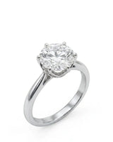 White gold moissanite engagement ring with round center stone and six-prong solitaire setting | SARATTI