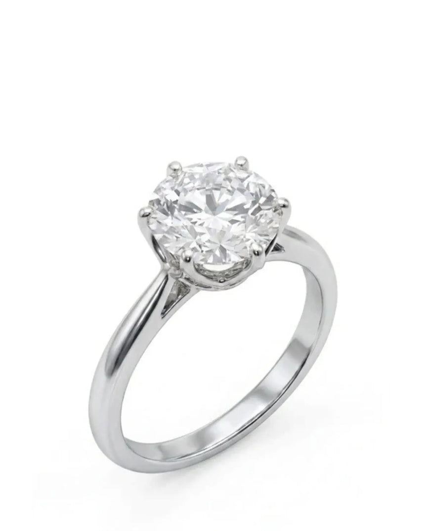White gold moissanite engagement ring with round center stone and six-prong solitaire setting | SARATTI