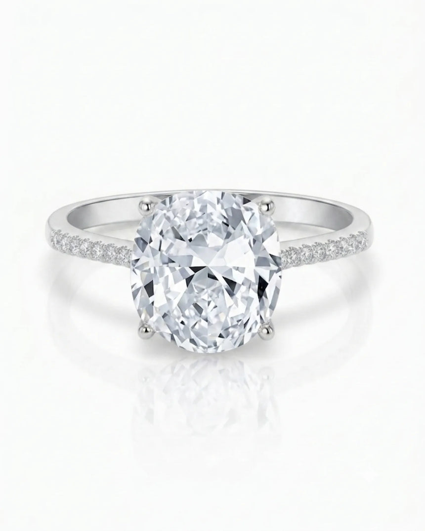 White gold moissanite ring with cushion center and refined pavé shoulders | SARATTI