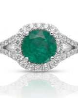 White gold natural emerald engagement ring with moissanite halo, split shank, and curved wedding band | SARATTI.