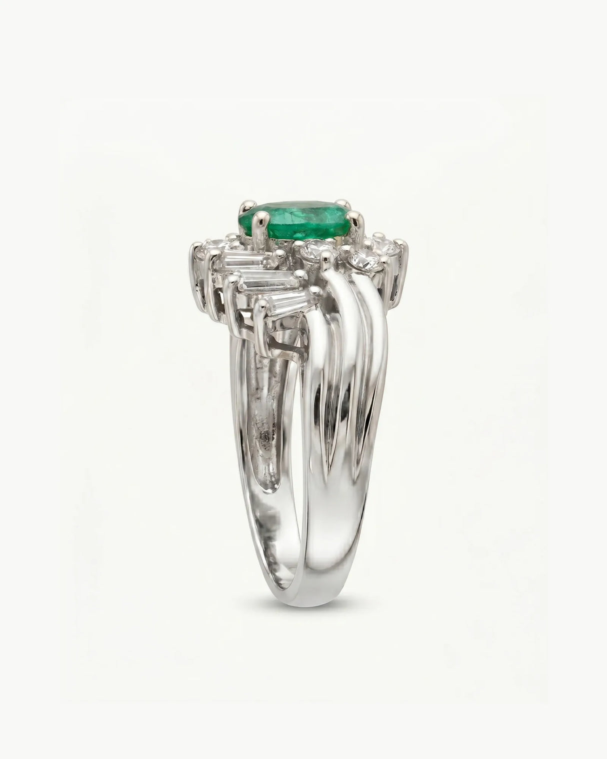 White gold natural emerald ring with asymmetrical diamond halo design | SARATTI