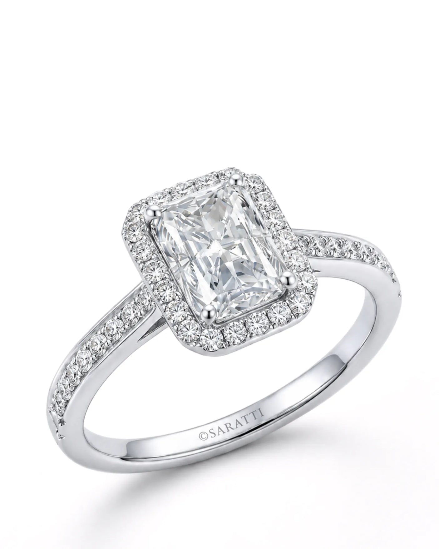 White gold radiant-cut moissanite engagement ring with round halo and pavé shoulders | SARATTI
