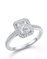 White gold radiant-cut moissanite engagement ring with round halo and pavé shoulders | SARATTI