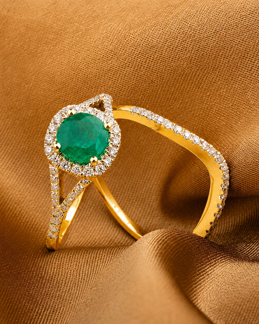 Yellow gold emerald engagement ring and matching curved band for a romantic proposal | SARATTI