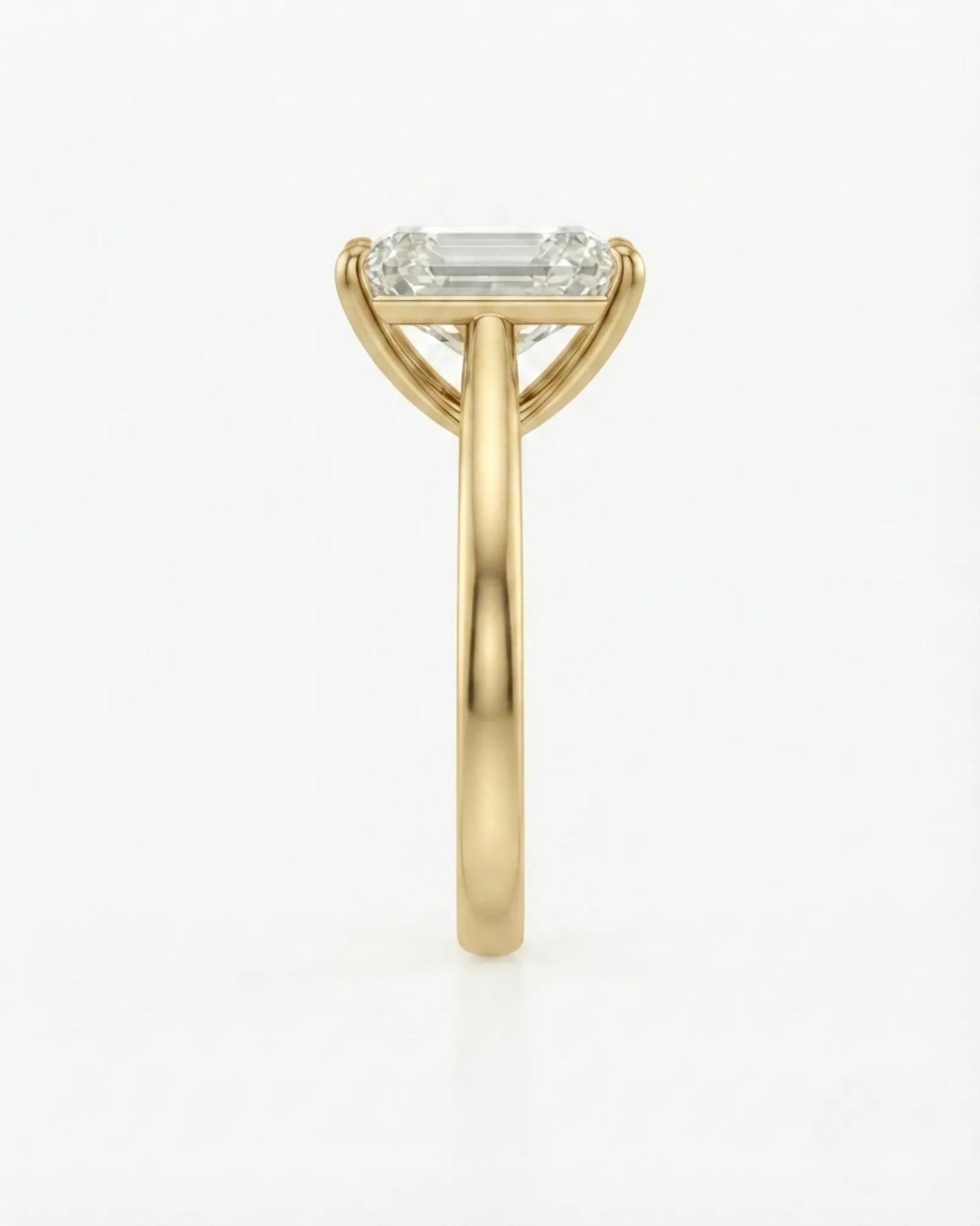 Yellow gold moissanite engagement ring for a sophisticated proposal with timeless emerald-cut elegance | SARATTI