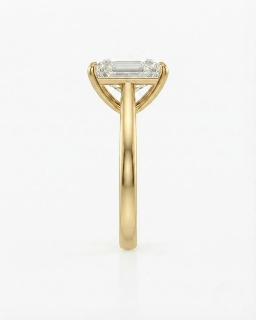 Yellow gold moissanite engagement ring for a sophisticated proposal with timeless emerald-cut elegance | SARATTI