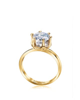 Yellow gold moissanite engagement ring with round center stone and sculpted six-prong solitaire setting | SARATTI