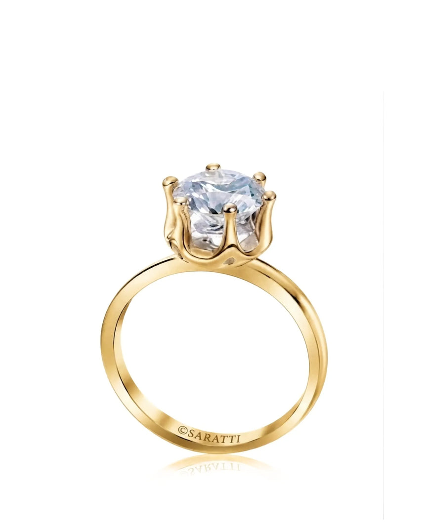 Yellow gold moissanite engagement ring with round center stone and sculpted six-prong solitaire setting | SARATTI