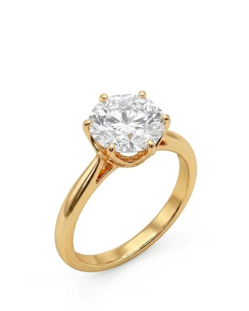 Yellow gold moissanite engagement ring with round center stone and six-prong solitaire setting | SARATTI