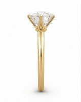Yellow gold moissanite solitaire engagement ring for a warm and timeless proposal | SARATTI