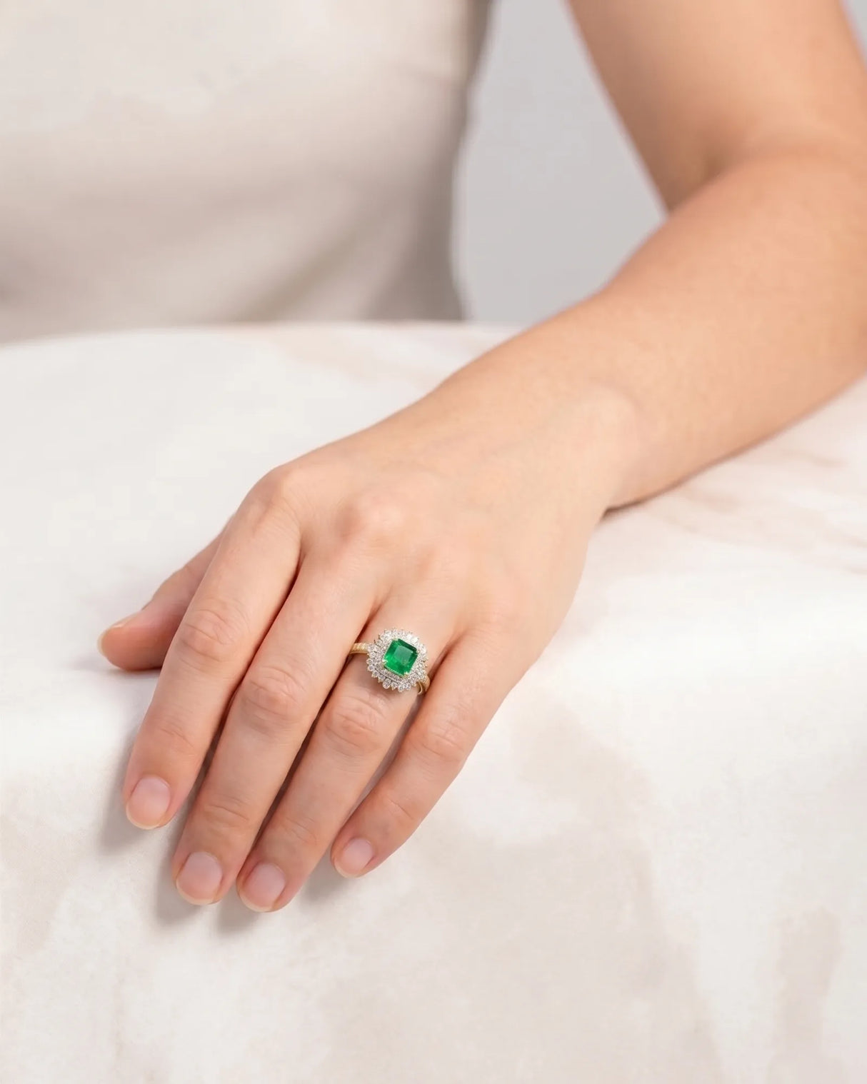 Yellow gold natural emerald statement ring with round and baguette diamond accents | SARATTI