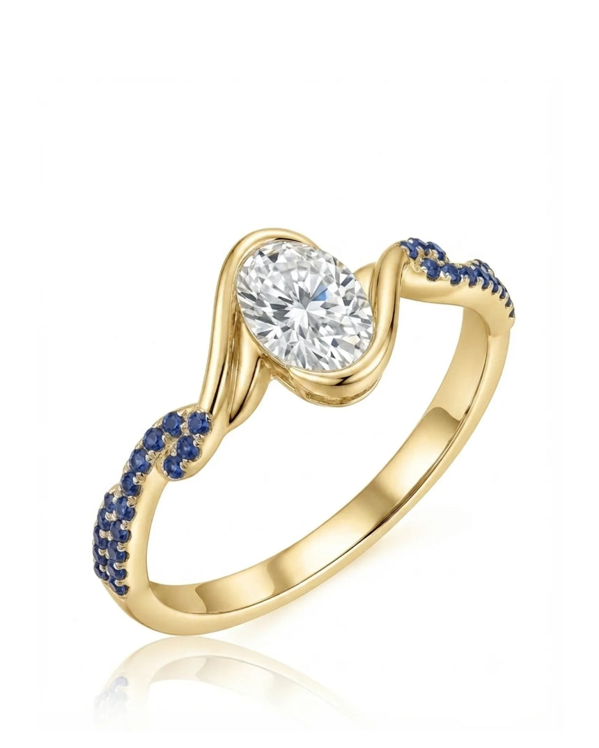 Yellow gold oval moissanite engagement ring with natural blue sapphire accents and flowing bezel design | SARATTI