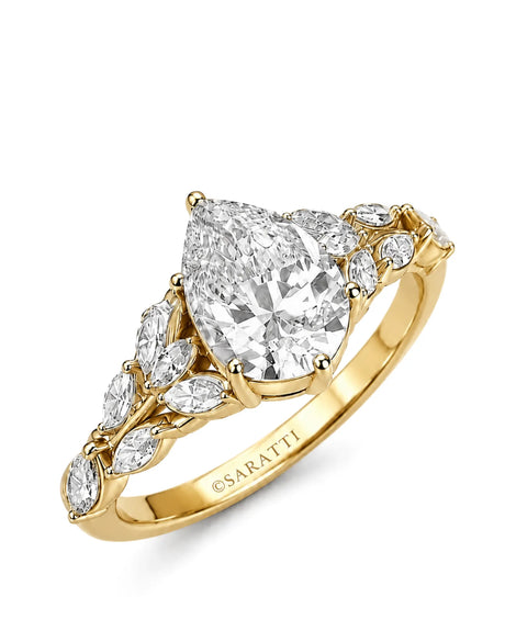 Yellow gold pear shaped moissanite ring with marquise side stones and vintage vine design | SARATTI