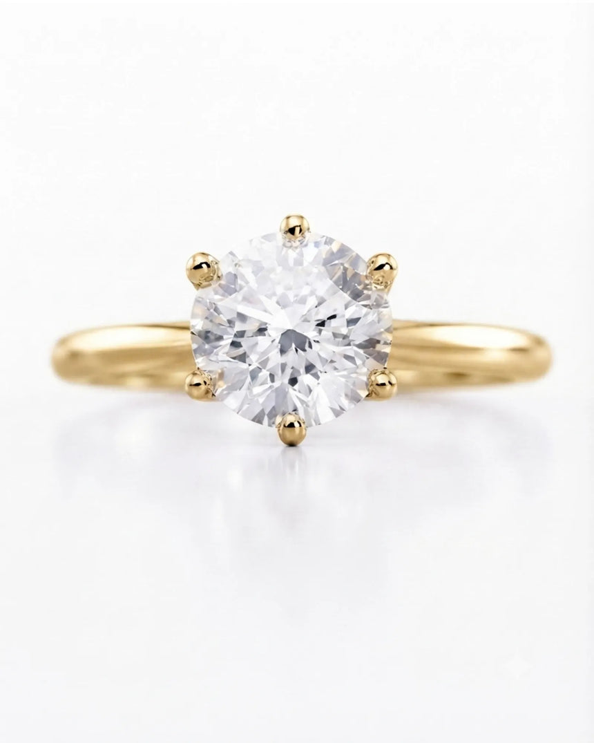 Yellow gold round moissanite engagement ring for a timeless and meaningful proposal | SARATTI