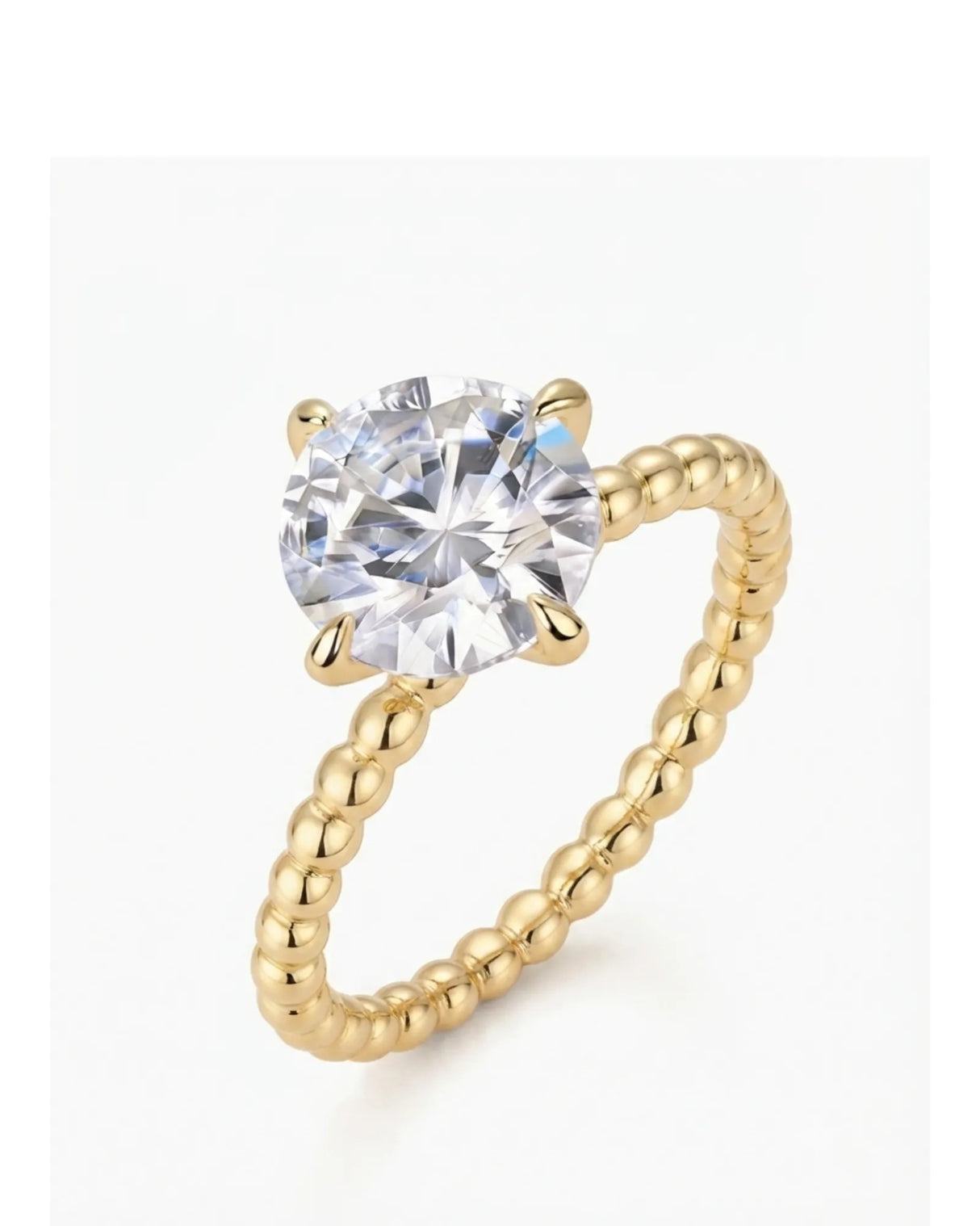 Yellow gold round moissanite engagement ring with polished beaded band and four-prong solitaire setting | SARATTI