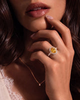Yellow sapphire and diamond engagement ring with halo design in rose gold | SARATTI