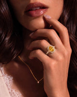 Yellow sapphire and diamond engagement ring with halo design in yellow gold | SARATTI