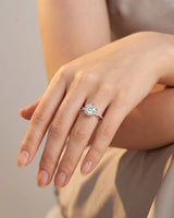 Yuma The Whispering Dawn natural round diamond halo ring model hand view in Platinum | SARATTI
